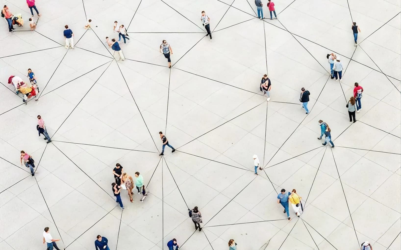 Top-down view of people on a plaza connected by a network of lines